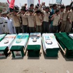 Yemeni people attend the funeral of victims of a Saudi-led airstrike, in Saada, Yemen, Monday, Aug. 13, 2018. Yemen's shiite rebels are backing a United Nations' call for an investigation into the airstrike in the country's north that killed dozens of people including many children. (AP Photo/Hani Mohammed)