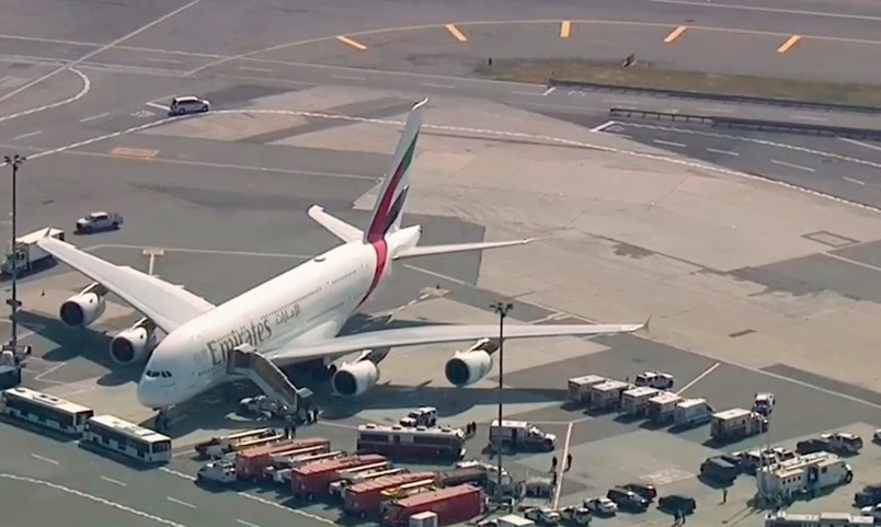 In this image made from video provided by WABC 7, emergency response crews gather outside a plane at JFK Airport after several passengers became sick on an Emirates flight from Dubai Wednesday, Sept. 5, 2018, in New York. (WABC 7 via AP)
