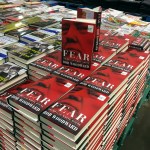 Copies of Bob Woodward's "Fear" are seen for sale at Costco, Wednesday, Sept. 11, 2018 in Arlington, Va. It's not clear whether President Donald Trump has much to fear from "Fear" itself. But the book of that name has set off a yes-no war between author Bob Woodward and the president, using all the assets they can muster. (AP Photo/Pablo Martinez Monsivais)