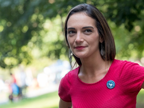 In this Wednesday, Aug. 15, 2018, photo, Democratic New York state Senate candidate Julia Salazar smiles as she speaks to a supporter before a rally in McCarren Park in the Brooklyn borough of New York. In a year in which establishment Democrats have found themselves stalked, and sometimes beaten, by more liberal challengers, Salazar seems well-positioned to become the next insurgent to knock off an incumbent. (AP Photo/Mary Altaffer)