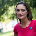 In this Wednesday, Aug. 15, 2018, photo, Democratic New York state Senate candidate Julia Salazar smiles as she speaks to a supporter before a rally in McCarren Park in the Brooklyn borough of New York. In a year in which establishment Democrats have found themselves stalked, and sometimes beaten, by more liberal challengers, Salazar seems well-positioned to become the next insurgent to knock off an incumbent. (AP Photo/Mary Altaffer)