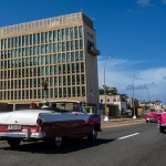 Tourists ride classic convertible cars on the Malecon beside the United States Embassy in Havana, Cuba, Tuesday, Oct. 3, 2017. Thousands of private Cuban businesses have invested heavily in private homes, cars and restaurants, hoping to cash in on an expected wave of American travelers to the island. Now that the U.S. State Department has issued a travel warning for the country, their investments are at risk.(AP Photo/Desmond Boylan)