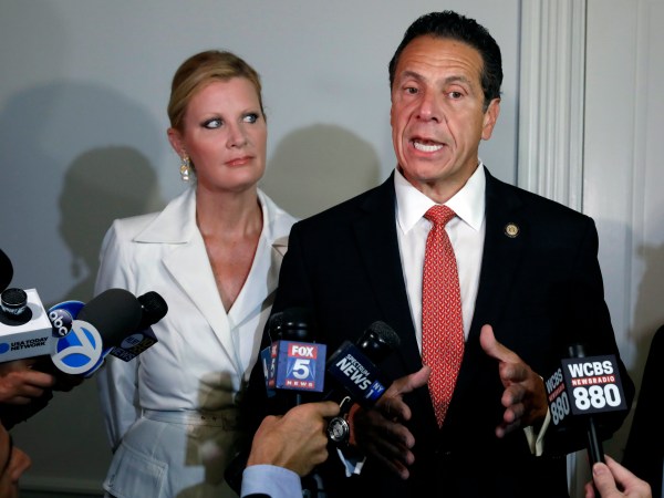 New York Gov. Andrew Cuomo is accompanied by his girlfriend Sandra Lee as he talks to the press after casting his primary election ballot, at the Presbyterian Church of Mount Kisco, in Mt. Kisco, NY, Thursday, Sept. 13, 2018. (AP Photo/Richard Drew)
