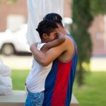 EL PASO, TX July 20: Ariel Romero and his son Jose Romero, 7, of Honduras cry outside of the Loretto-Nazareth Migrant Shelter in El Paso, Texas on July 20, 2018. (Photo by Ivan Pierre Aguirre/ For The Washington Post)