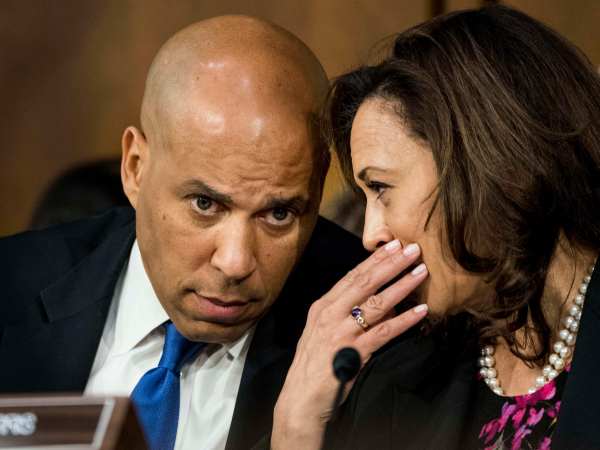 WASHINGTON, DC - Senators Corey Booker (D-NJ) and Kamala Harris (D-CA) speak quietly during Supreme Court nominee Brett Kavanaugh's confirmation hearing in the Senate Judiciary Committee on Capitol Hill in Washington, DC on Tuesday September 4, 2018. (Photo by Melina Mara/The Washington Post)