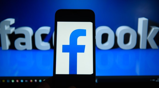 KRAKOW, POLAND - 2018/09/06: Facebook  logo is seen on an android mobile phone in front of a computer screen  with facebook sign. (Photo by Omar Marques/SOPA Images/LightRocket via Getty Images)
