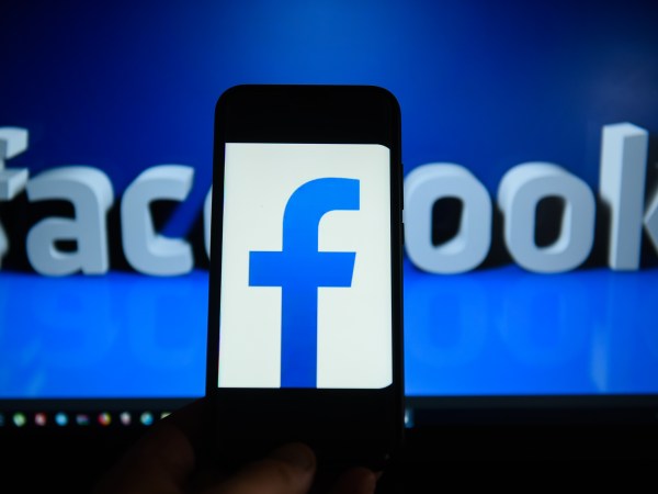 KRAKOW, POLAND - 2018/09/06: Facebook  logo is seen on an android mobile phone in front of a computer screen  with facebook sign. (Photo by Omar Marques/SOPA Images/LightRocket via Getty Images)