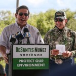Alligator Ron Bergeron, back right, takes GOP Florida Gubernatorial Candidate Ron DeSantis, left, and some of DeSantis' staff on an airboat tour of the Florida Everglades as he and Bergeron discuss the historical and current critical restoration efforts taking place, on Wednesday, Sept. 12, 2018. Bergeron is a former Florida Fish and Wildlife Conservation Commissioner and champion of the Florida Everglades. (Patrick Farrell/Miami Herald/TNS)