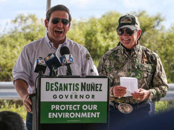 Alligator Ron Bergeron, back right, takes GOP Florida Gubernatorial Candidate Ron DeSantis, left, and some of DeSantis' staff on an airboat tour of the Florida Everglades as he and Bergeron discuss the historical and current critical restoration efforts taking place, on Wednesday, Sept. 12, 2018. Bergeron is a former Florida Fish and Wildlife Conservation Commissioner and champion of the Florida Everglades. (Patrick Farrell/Miami Herald/TNS)