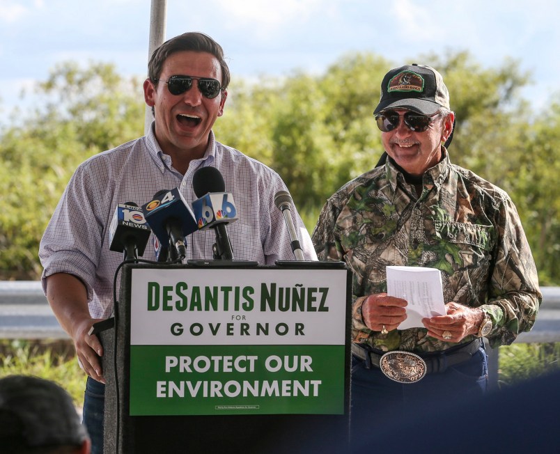 Alligator Ron Bergeron, back right, takes GOP Florida Gubernatorial Candidate Ron DeSantis, left, and some of DeSantis' staff on an airboat tour of the Florida Everglades as he and Bergeron discuss the historical and current critical restoration efforts taking place, on Wednesday, Sept. 12, 2018. Bergeron is a former Florida Fish and Wildlife Conservation Commissioner and champion of the Florida Everglades. (Patrick Farrell/Miami Herald/TNS)