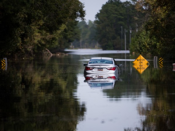 LONGS, SC - SEPTEMBER 21: A disabled car is surrounded by floodwaters caused by Hurricane Florence near the Todd Swamp on September 21, 2018 in Longs, South Carolina. Floodwaters are expected to rise in the area in through the weekend. (Photo by Sean Rayford/Getty Images)