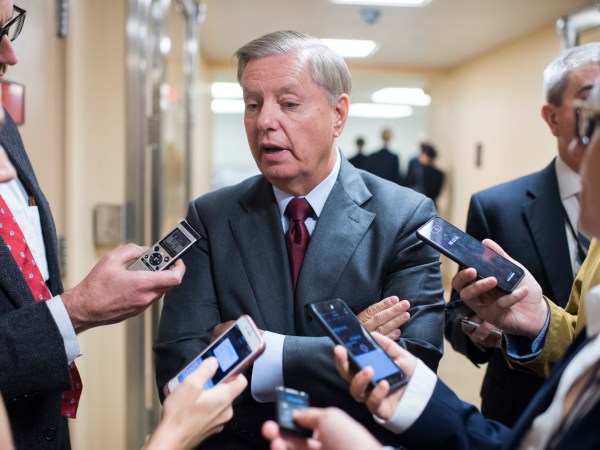 UNITED STATES - SEPTEMBER 25: Sen. Lindsey Graham, R-S.C., talks with reporters in the basement of the Capitol before the Senate policy luncheons on September 25, 2018. (Photo By Tom Williams/CQ Roll Call)