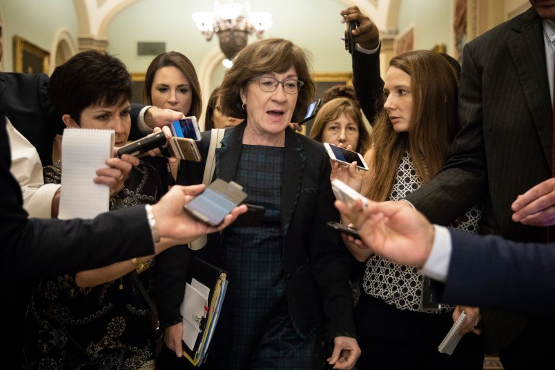 WASHINGTON, DC - SEPTEMBER 26: Sen. Susan Collins (R-ME) is surrounded by reporters following a closed-door meeting of Senate Republicans on Capitol Hill, September 26, 2018 in Washington, DC. Christine Blasey Ford, who has accused Kavanaugh of sexual assault, has agreed to testify before the Senate Judiciary Committee on Thursday. (Photo by Drew Angerer/Getty Images)