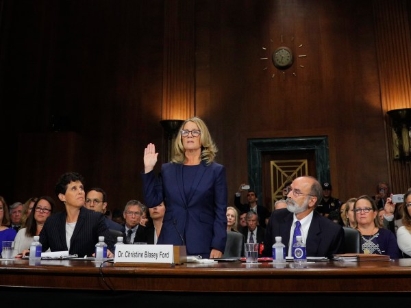 WASHINGTON, DC - SEPTEMBER 27: Professor Christine Blasey Ford, who accused U.S. Supreme Court nominee Brett Kavanaugh of a sexual assault in 1982, is sworn in to testify before a Senate Judiciary Committee confirmation hearing for Kavanaugh on Capitol Hill September 27, 2018 in Washington, DC. A professor at Palo Alto University and a research psychologist at the Stanford University School of Medicine, Ford has accused Supreme Court nominee Judge Brett Kavanaugh of sexually assaulting her during a party in 1982 when they were high school students in suburban Maryland. (Photo by Jim Bourg-Pool/Getty Images)