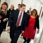 UNITED STATES - DECEMBER 11: Sen. Mark Begich, R-Alaska, and his staff make their way through Russell Building in en route to the Capitol to give his farewell speech on the Senate floor, December 11, 2014. Begich was defeated by sen.-elect Dan Sullivan, R-Alaska. (Photo By Tom Williams/CQ Roll Call)