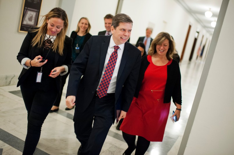 UNITED STATES - DECEMBER 11: Sen. Mark Begich, R-Alaska, and his staff make their way through Russell Building in en route to the Capitol to give his farewell speech on the Senate floor, December 11, 2014. Begich was defeated by sen.-elect Dan Sullivan, R-Alaska. (Photo By Tom Williams/CQ Roll Call)