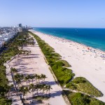 Florida, Miami Beach, aerial, overhead view, above, bird's eye view, Atlantic Ocean, sand, sunbathers, Lummus Park, Ocean Drive,