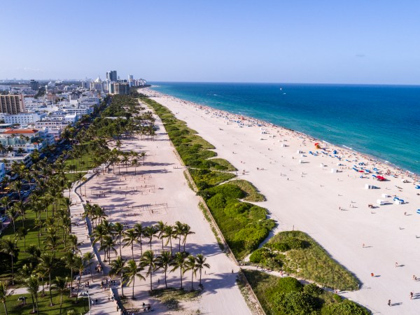 Florida, Miami Beach, aerial, overhead view, above, bird's eye view, Atlantic Ocean, sand, sunbathers, Lummus Park, Ocean Drive,