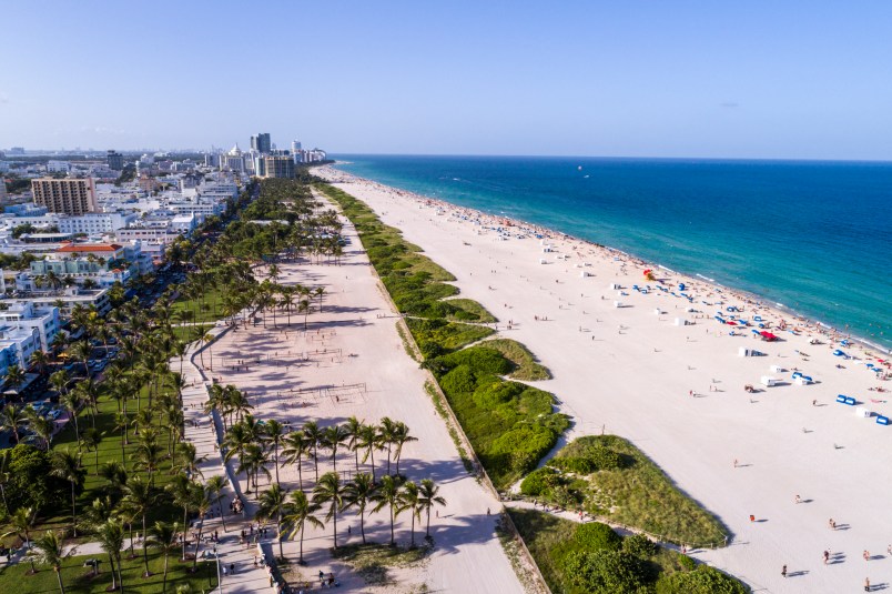 Florida, Miami Beach, aerial, overhead view, above, bird's eye view, Atlantic Ocean, sand, sunbathers, Lummus Park, Ocean Drive,