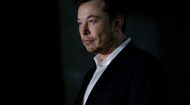 CHICAGO, IL - JUNE 14: Engineer and tech entrepreneur Elon Musk of The Boring Company listens as Chicago Mayor Rahm Emanuel talks about constructing a high speed transit tunnel at Block 37 during a news conference on June 14, 2018 in Chicago, Illinois. Musk said he could create a 16-passenger vehicle to operate on a high-speed rail system that could get travelers to and from downtown Chicago and O'hare International Airport under twenty minutes, at speeds of over 100 miles per hour. (Photo by Joshua Lott/Getty Images)