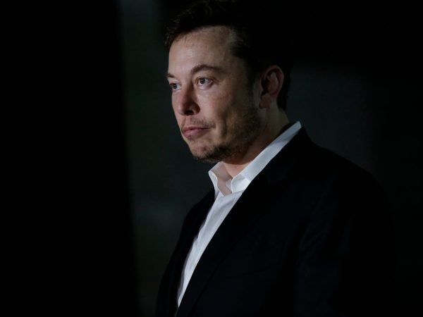 CHICAGO, IL - JUNE 14: Engineer and tech entrepreneur Elon Musk of The Boring Company listens as Chicago Mayor Rahm Emanuel talks about constructing a high speed transit tunnel at Block 37 during a news conference on June 14, 2018 in Chicago, Illinois. Musk said he could create a 16-passenger vehicle to operate on a high-speed rail system that could get travelers to and from downtown Chicago and O'hare International Airport under twenty minutes, at speeds of over 100 miles per hour. (Photo by Joshua Lott/Getty Images)