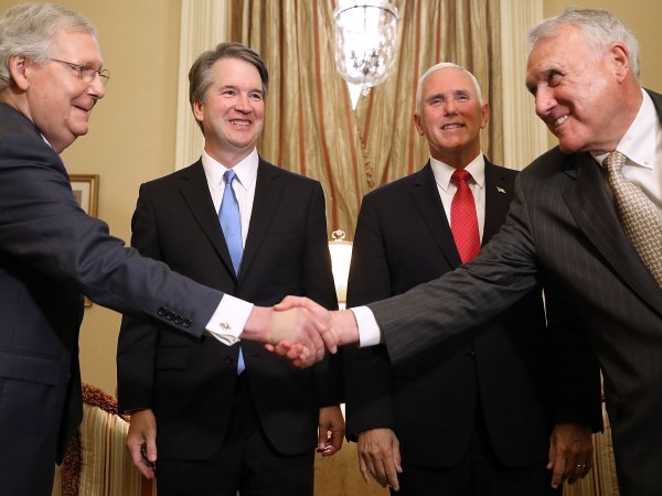 Judge Brett Kavanaugh poses for photographs with Vice President Mike Pence and Senate Majority Leader Mitch McConnell (R-KY) before a meeting in McConnell's office in the U.S. Capitol July 10, 2018 in Washington, DC. U.S. President Donald Trump nominated Kavanaugh to succeed retiring Supreme Court Associate Justice Anthony Kennedy.