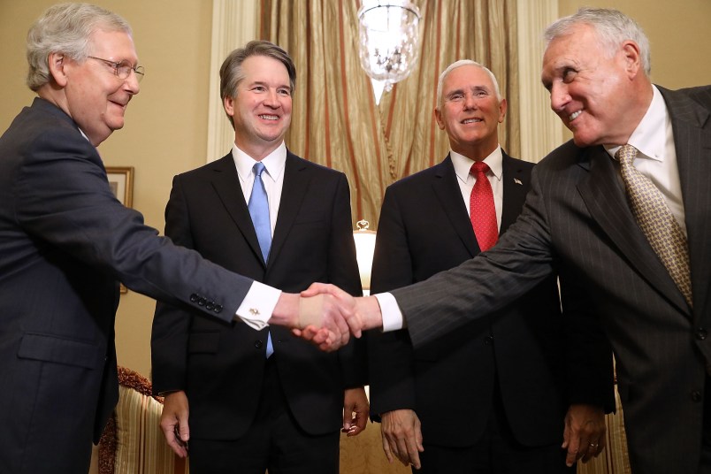 Judge Brett Kavanaugh poses for photographs with Vice President Mike Pence and Senate Majority Leader Mitch McConnell (R-KY) before a meeting in McConnell's office in the U.S. Capitol July 10, 2018 in Washington, DC. U.S. President Donald Trump nominated Kavanaugh to succeed retiring Supreme Court Associate Justice Anthony Kennedy.