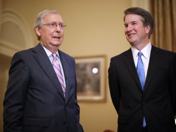 Judge Brett Kavanaugh poses for photographs with Vice President Mike Pence and Senate Majority Leader Mitch McConnell (R-KY) before a meeting in McConnell's office in the U.S. Capitol July 10, 2018 in Washington, DC. U.S. President Donald Trump nominated Kavanaugh to succeed retiring Supreme Court Associate Justice Anthony Kennedy.