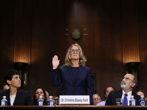 WASHINGTON, DC - SEPTEMBER 27:  Christine Blasey Ford (C) is sworn in before testifying the Senate Judiciary Committee with her attorneys Debra Katz (L) and Michael Bromwich (R) in the Dirksen Senate Office Building on Capitol Hill September 27, 2018 in Washington, DC. A professor at Palo Alto University and a research psychologist at the Stanford University School of Medicine, Ford has accused Supreme Court nominee Judge Brett Kavanaugh of sexually assaulting her during a party in 1982 when they were high school students in suburban Maryland. In prepared remarks, Ford said, ?I don?t have all the answers, and I don?t remember as much as I would like to. But the details about that night that bring me here today are ones I will never forget. They have been seared into my memory and have haunted me episodically as an adult.?  (Photo by Win McNamee/Getty Images)
