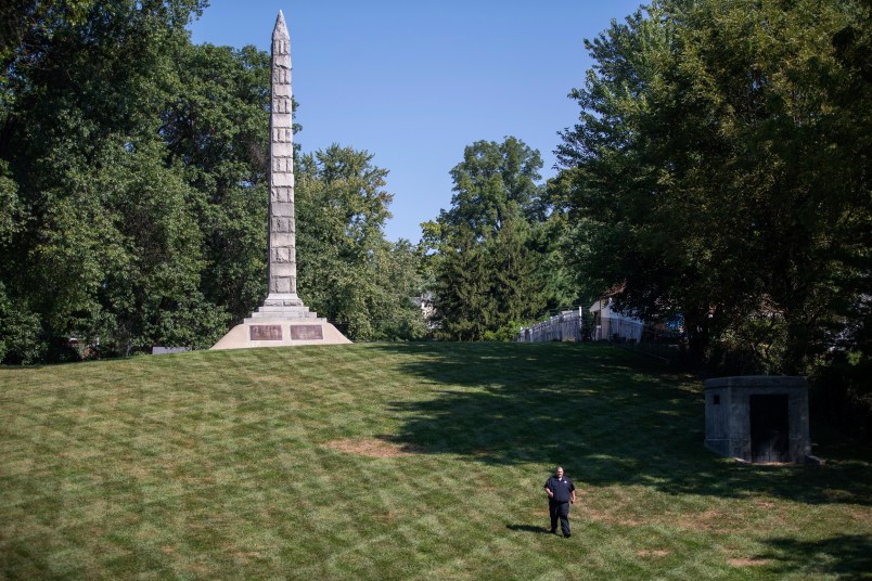 PLEASE HOLD FOR STORY SLUGGED CONFEDERATE CEMETERIES SECURITY BY JIM SALTER -  In this photo made Wednesday, Sept. 19, 2018, a security guard walks the grounds at North Alton Confederate Cemetery in Alton, Ill. The federal government has hired private security firms to guard several Confederate memorials across the U.S in the aftermath of clashes between white nationalists and counter-protesters last year. Information obtained by The Associated Press shows that nearly $3 million has been spent on contracted security since last summer and another $1.6 million is budgeted for similar protection in fiscal 2019. (AP Photo/Jeff Roberson)