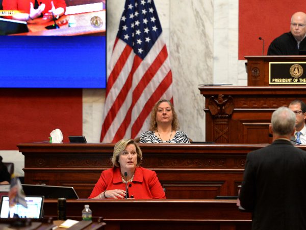 West Virginia House Judiciary Chairman John Shott(right, back to camera) questions Supreme Court Justice Beth Walker during her Impeachment trial Monday October 1, 2018.  The West Virginia Senate is impeaching all five sitting West Virginia Supreme Court Justices over misspent public funds. (KennyKemp/GazetteMail via AP)
