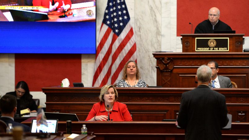 West Virginia House Judiciary Chairman John Shott(right, back to camera) questions Supreme Court Justice Beth Walker during her Impeachment trial Monday October 1, 2018.  The West Virginia Senate is impeaching all five sitting West Virginia Supreme Court Justices over misspent public funds. (KennyKemp/GazetteMail via AP)