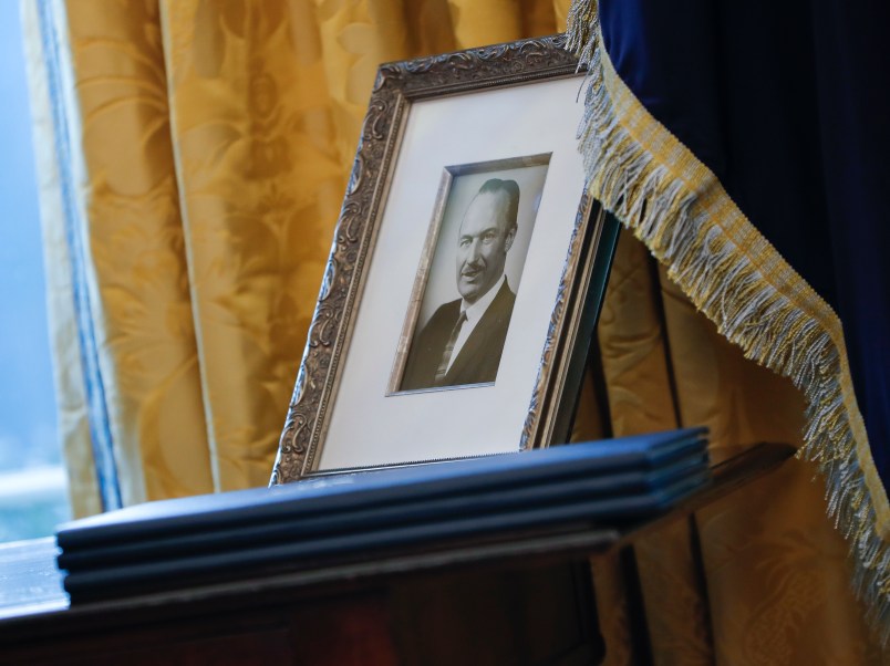 A portrait of President Donald Trump's father Fred Trump, and 3 un-signed Executive orders are seen in the Oval Office of the White House in Washington, Thursday, Feb. 9, 2017 during the swearing in ceremony for Attorney General Jeff Sessions. (AP Photo/Pablo Martinez Monsivais)