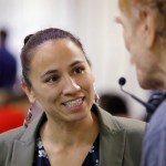 HOLD FOR STORY - FILE - In this Oct. 1, 2018, file photo, Democratic Congressional candidate Sharice Davids talks to volunteer at her campaign office in Overland Park, Kan. Davids is challenging Republican incumbent Kevin Yoder in Kansas' 3rd District. (AP Photo/Charlie Riedel, File)