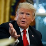 President Donald Trump speaks during an interview with The Associated Press in the Oval Office of the White House, Tuesday, Oct. 16, 2018, in Washington. (AP Photo/Evan Vucci)