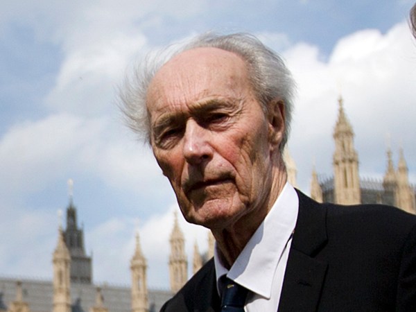 Former Norwegian war hero and resistance fighter Joachim Roenneberg, 93 years old, holds a Union flag as he walks in a park near the Palace of Westminster, after he received the Union Jack Medal for his efforts and cooperation with the British during the second World War, and especially at Vemork in Norway- 70 years ago, in London, Thursday, April  25, 2013. (AP Photo/Alastair Grant)