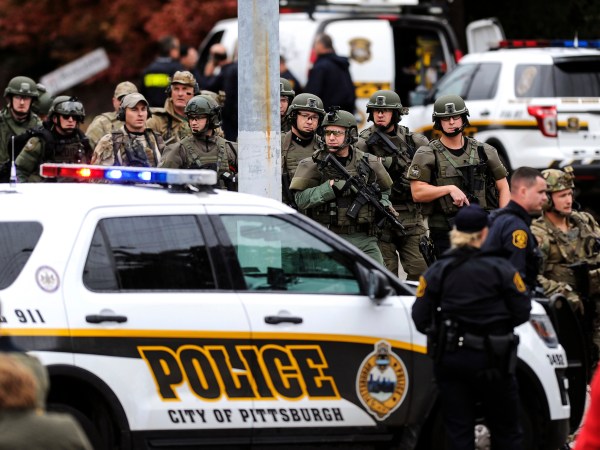 Law enforcement officers secure the scene where multiple people were shot, Oct, 27, 2018, at The Tree of Life Congregation synagogue in Squirrel Hill. (Alexandra Wimley/Pittsburgh Post-Gazette via AP)