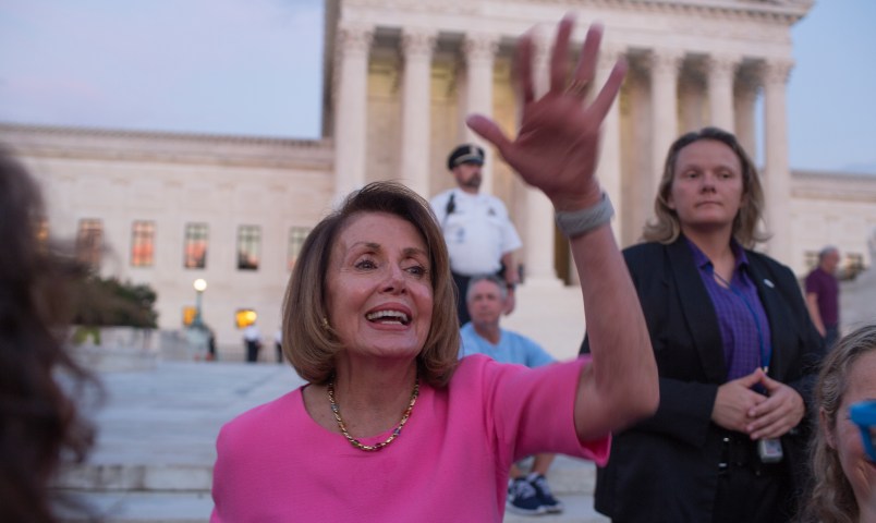 WASHINGTON, D.C. - OCTOBER 3: House minority leader Nancy Pelosi mingles with a crowd, mostly of women, who have gathered outside of the Supreme Court to oppose Judge Kavanaugh's nomination to the Supreme Court on the evening of October 3, 2018 in Washington, D.C. (Photo by Andrew Lichtenstein/Corbis via Getty Images)
