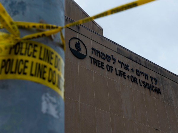 TREE OF LIFE SYNAGOGUE, PITTSBURGH, PENNSYLVANIA, UNITED STATES - 2018/10/29: Police tape wrapped around a traffic light pole out front of the Tree of Life Synagogue in Squirrel Hill outside of Pittsburgh. Members of Pittsburgh and the Squirrel Hill community pay their respects at the memorial to the 11 victims of the Tree of Life Synagogue massacre perpetrated by suspect Robert Bowers on Saturday, October 27. (Photo by Matthew Hatcher/SOPA Images/LightRocket via Getty Images)