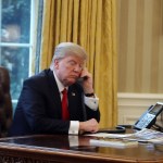 WASHINGTON, DC - JANUARY 29:  President Donald Trump is seen through a window speaking on the phone with King of Saudi Arabia, Salman bin Abd al-Aziz Al Saud, in the Oval Office of the White House, January 29, 2017 in Washington, DC. On Sunday, President Trump is making several phone calls with world leaders from the Oval Office.  (Photo by Mark Wilson/Getty Images)