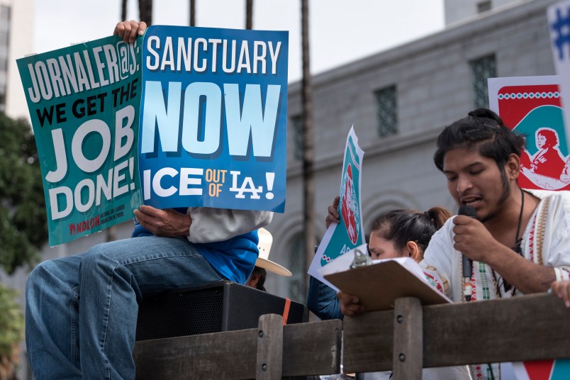Protesters at a pro-immigration rally where organizers called for a stop to the Immigration and Customs Enforcement (ICE) raids and deportations of illegal immigrants and to officially establish Los Angeles as a sanctuary city. Los Angeles, California February 18, 2017.  (Photo by Ronen Tivony/NurPhoto)