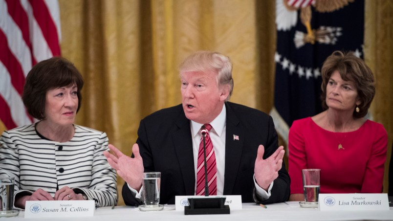 WASHINGTON, DC - JUNE 27: President Donald Trump, center, speaks as he meets with Republican senators about health care in the East Room of the White House of the White House in Washington, DC on Tuesday, June 27, 2017. Seated with him are Sen. Susan Collins, R-Maine, left, and Sen. Lisa Murkowski, R-Alaska, right, (Photo by Jabin Botsford/The Washington Post)