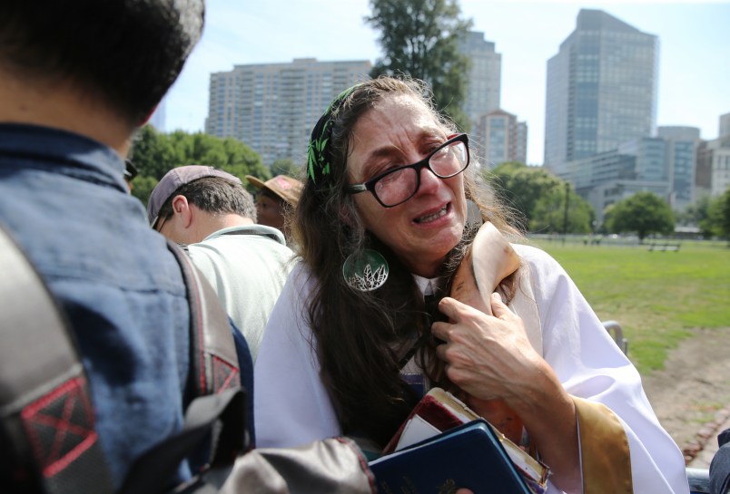 BOSTON - AUGUST 19: Anne Armstrong embraces her shofar while waiting to enter the “Boston Free Speech” rally where she planned to offer an opening prayer on the Boston Common, Aug. 19, 2017. (Photo by Craig F. Walker/The Boston Globe via Getty Images)