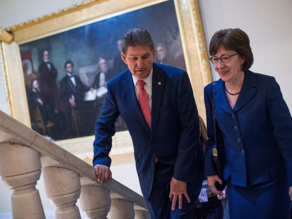 UNITED STATES - JANUARY 22: Sens. Joe Manchin, D-W.Va., and Susan Collins, R-Maine, make their way to a news conference in the Capitol after the Senate passed a continuing resolution to reopen the government on January 22, 2018. (Photo By Tom Williams/CQ Roll Call)