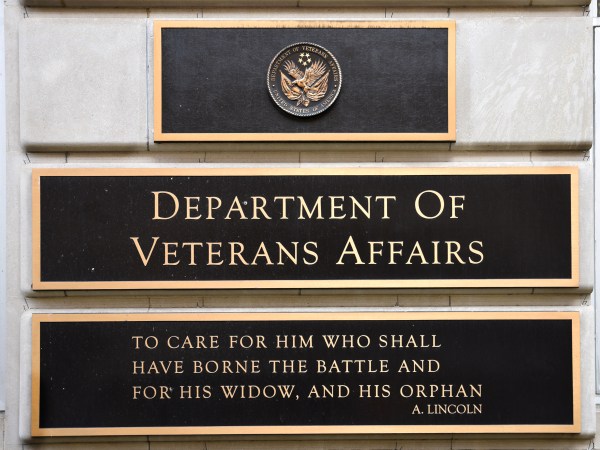 WASHINGTON, D.C. - APRIL 22, 2018:  A metal plaque on the facade of the Department of Veterans Affairs building in Washington, D.C., features a quotation by Abraham Lincoln. (Photo by Robert Alexander/Getty Images)