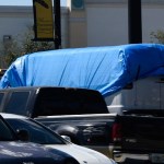 A van covered in blue tarp is towed by FBI investigators on October 26, 2018, in Plantation, Florida, in connection with the 12 pipe bombs and suspicious packages mailed to top Democrats. - A suspect identified by investigators as Cesar Sayoc, 56, was arrested near an Auto store in Plantation. (Photo by Michele Eve Sandberg / AFP)        (Photo credit should read MICHELE EVE SANDBERG/AFP/Getty Images)