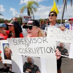 A crowd protests outside the Broward County Supervisor of Elections office Nov. 9, 2018, in Lauderhill, Fla.  (AP Photo/Joe Skipper)