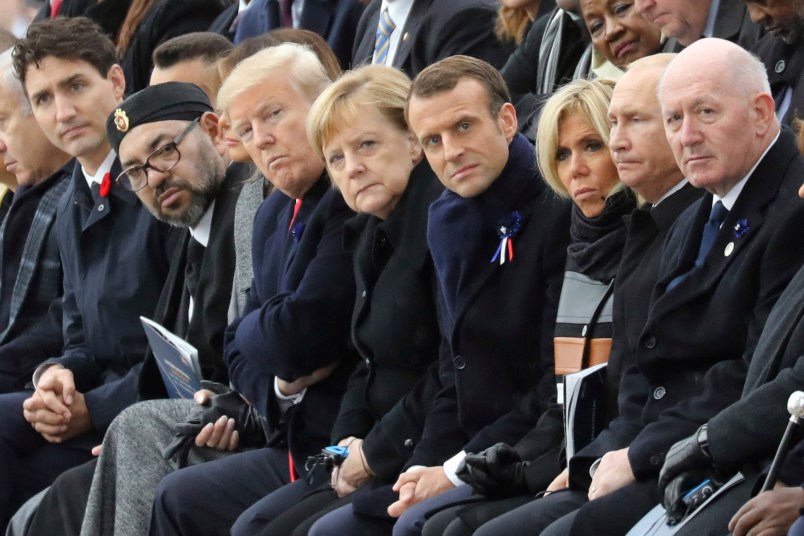 (From L) Canadian Prime Minister Justin Trudeau, Morocco's Prince Moulay Hassan, Moroccan King Mohammed VI, US First Lady Melania Trump, US President Donald Trump, German Chancellor Angela Merkel, French President Emmanuel Macron and his wife Brigitte Macron, Russian President Vladimir Putin and Australian Governor-General Peter Cosgrove attend a ceremony the Arc de Triomphe in Paris, France, as part of the commemorations marking the 100th anniversary of the 11 November 1918 armistice, ending World War I, Sunday, Nov. 11, 2018. (Ludovic Marin/Pool Photo via AP)