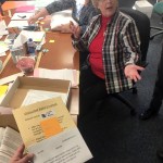 This Nov. 23, 2018 photo shows Alaska State Review Board ballot examiner Stuart Sliter reacting when a loose ballot from a tied state House race is found without an envelope in Juneau, Alaska. Officials are investigating the origin of the ballot and will decide by Friday, Nov. 30, 2018, whether to count it during a recount of the Fairbanks House District 1 race. (James Brooks/Anchorage Daily News via AP)