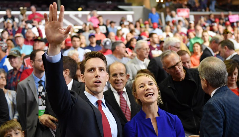 US senatorial candidate Attorney General Josh Hawley (l) and his wife Erin Morrow Hawleyare seen at a rally at JQH Arena in Springfield, Missouri on September 21, 2018. (Photo by MANDEL NGAN / AFP)        (Photo credit should read MANDEL NGAN/AFP/Getty Images)